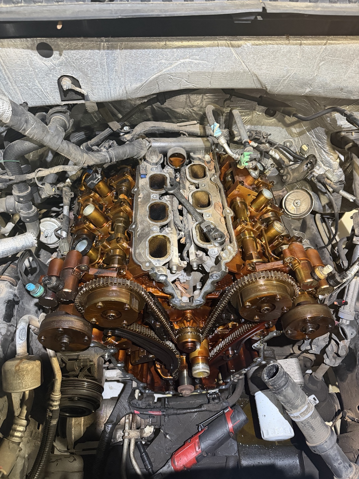 Engine with timing components exposed during repair